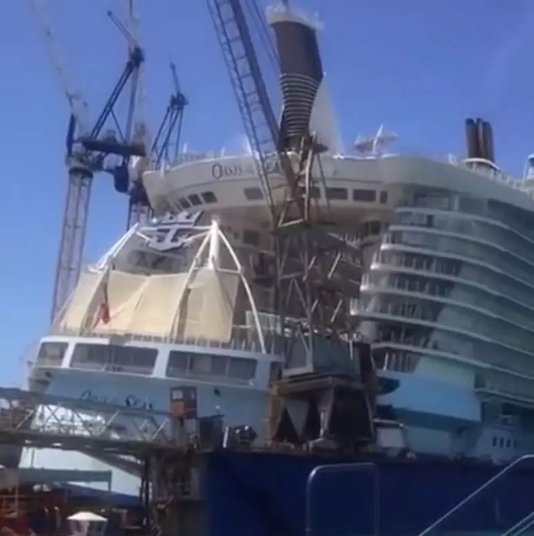 The crane came down on the huge ship's stern.