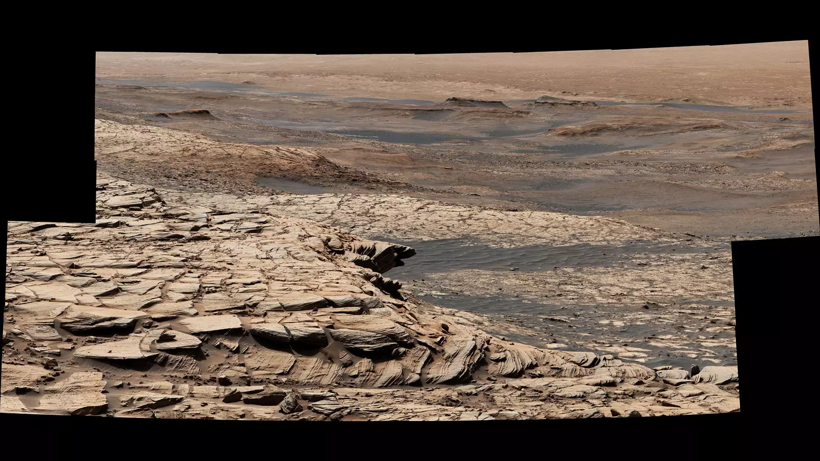 A stitched up photo from NASA of the surface of Mars.