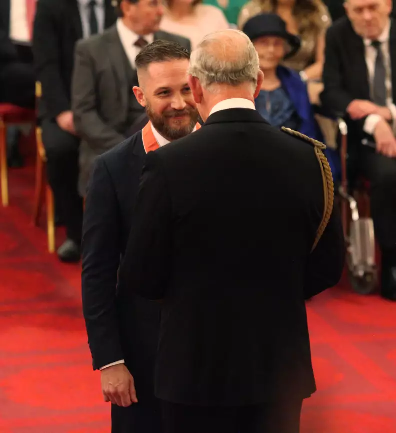 Tom Hardy receiving his CBE at Buckingham Palace.