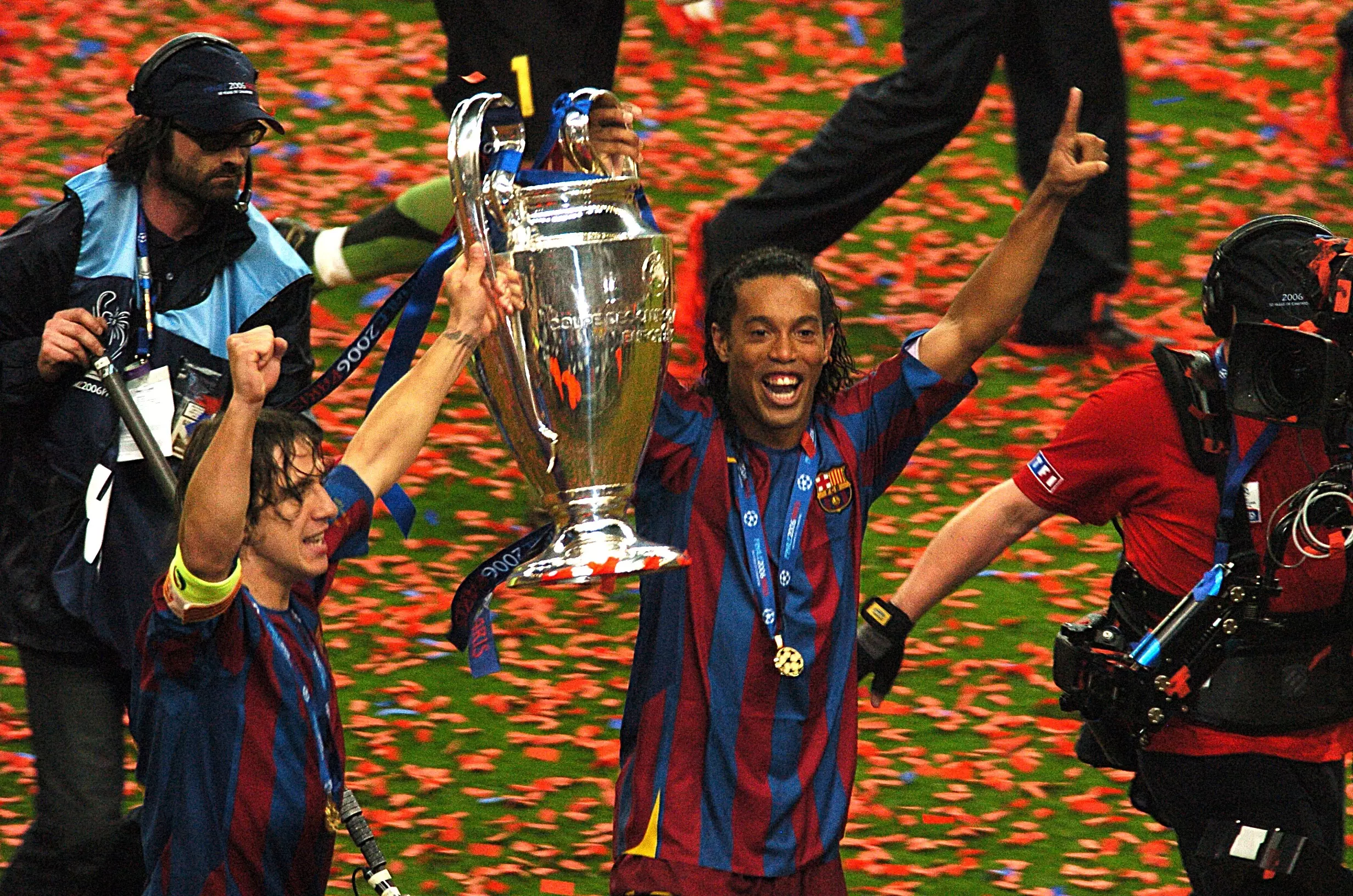 Ronaldinho celebrates with the Champions League trophy. Image: PA Images