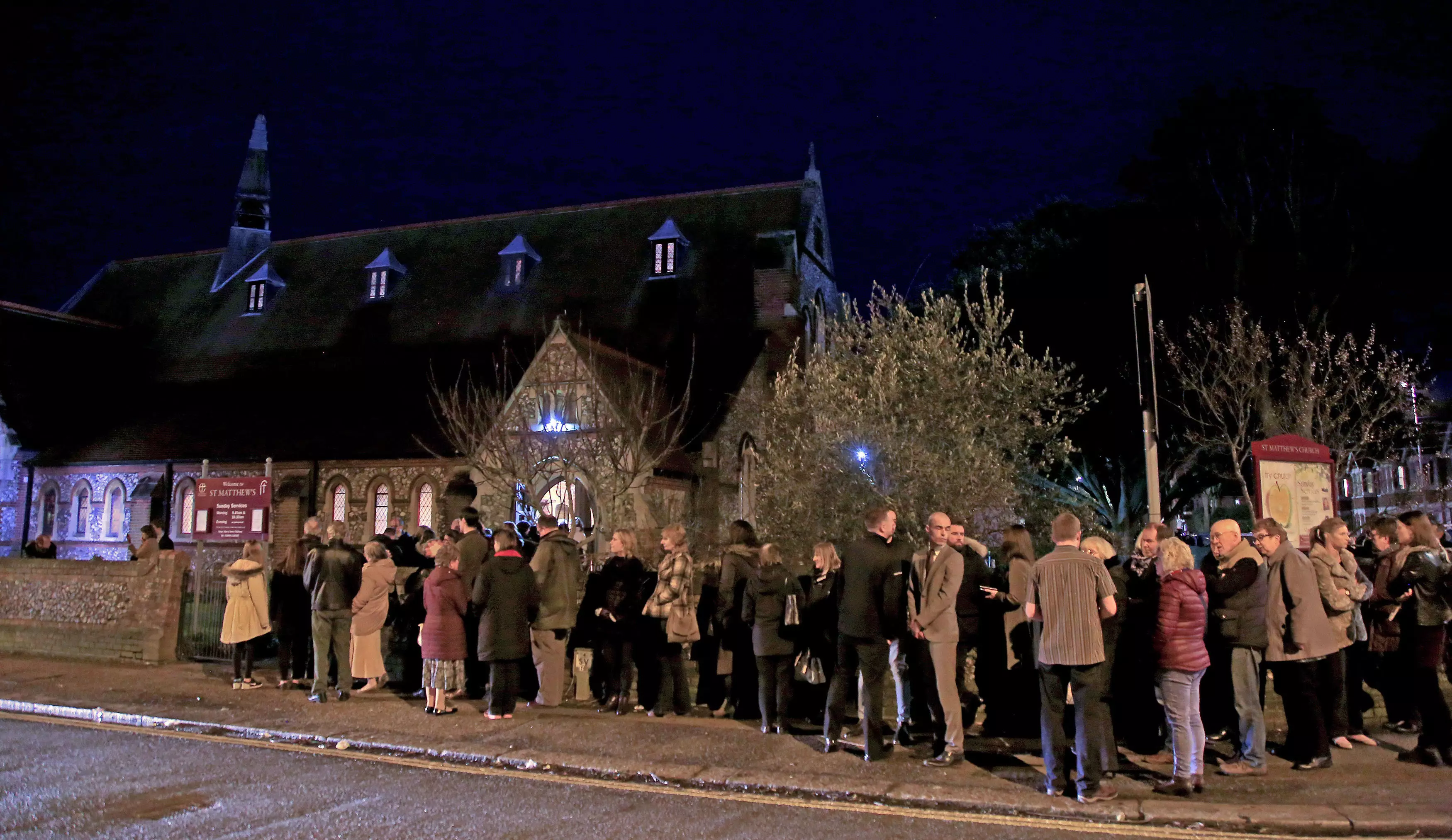 Mourners gather at St. Matthews Church in Worthing, West Sussex, for a memorial service for Stuart and Jason Hill, who were killed alongside Becky Dobson.