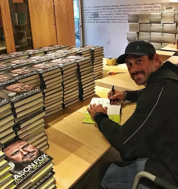Jason, pictured signing his book, said he started to feel better after visiting a therapist.