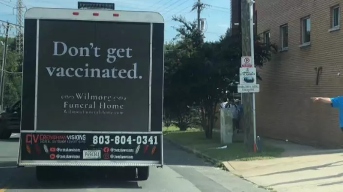 'Funeral Home' Trolls Anti-Vaxxers With Dark Roving Billboard