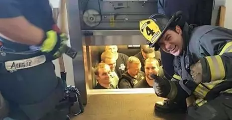 Firemen Rescue Police After They Get Stuck In Lift