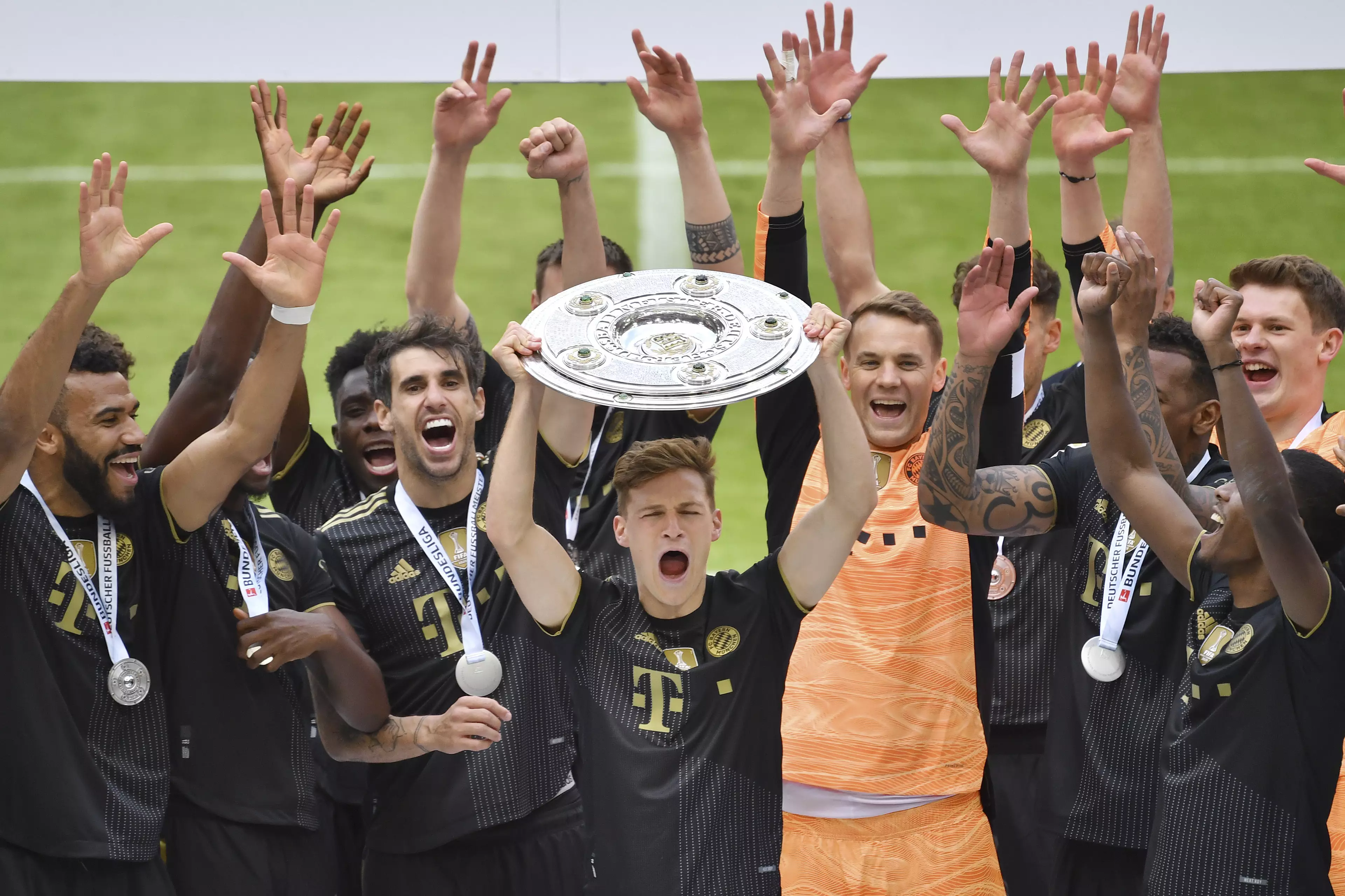 Kimmich lifts the Bundesliga title. Image: PA Images
