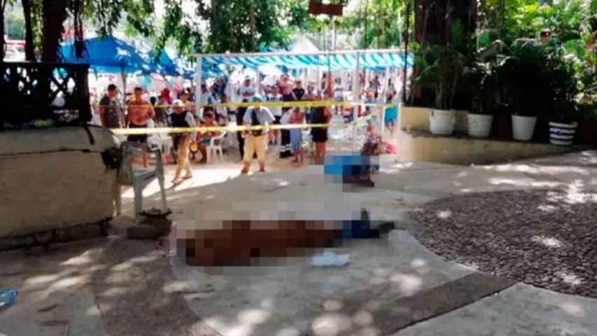 Holidaymakers Soak Up The Sun Just Metres Away From Dead Bodies