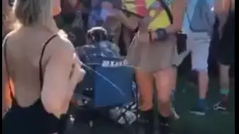 Bizarre Video Shows Woman Spraying Her Breast Milk Around At Festival 