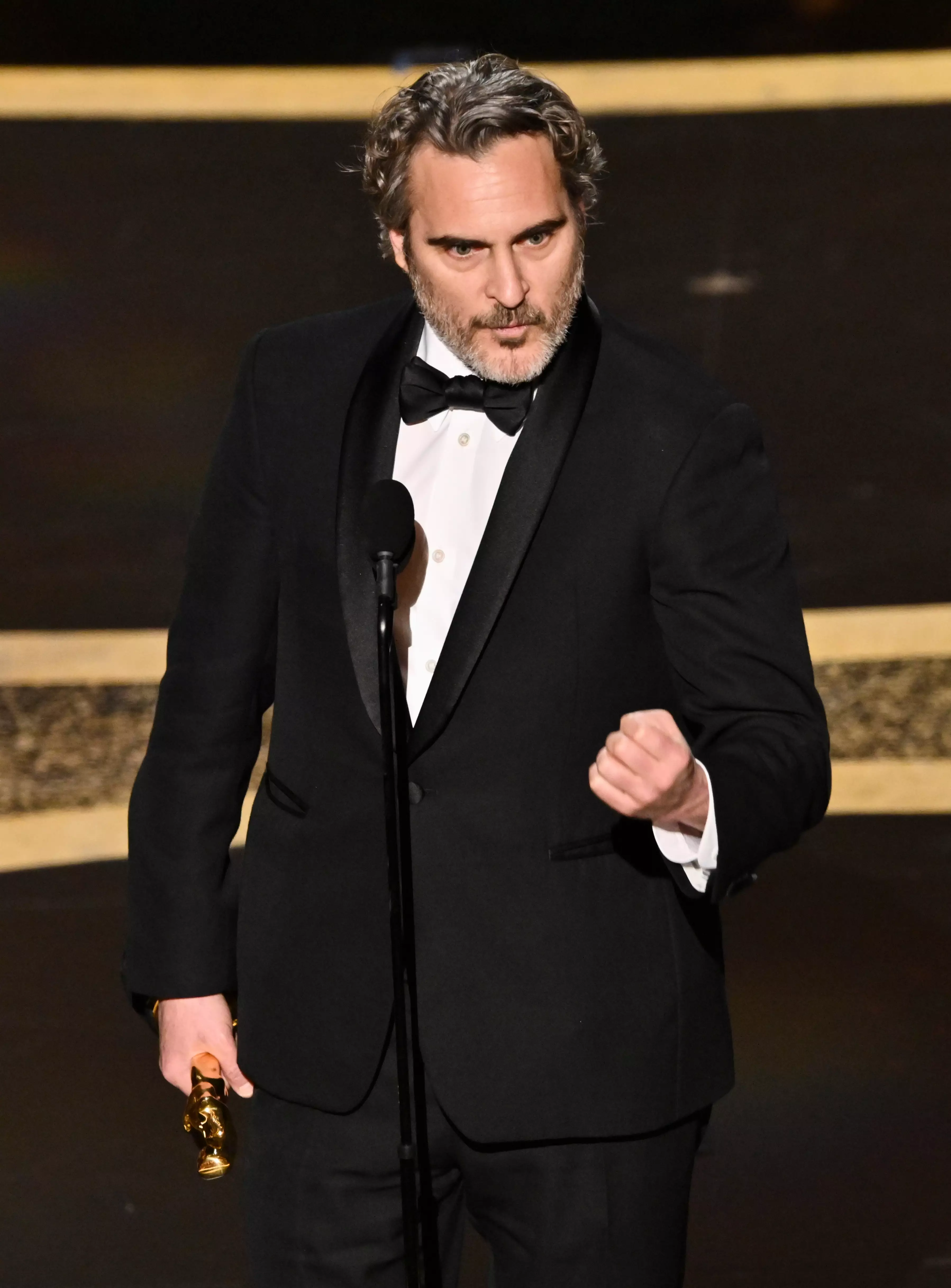 Joaquin Phoenix picking up his award for Best Actor.