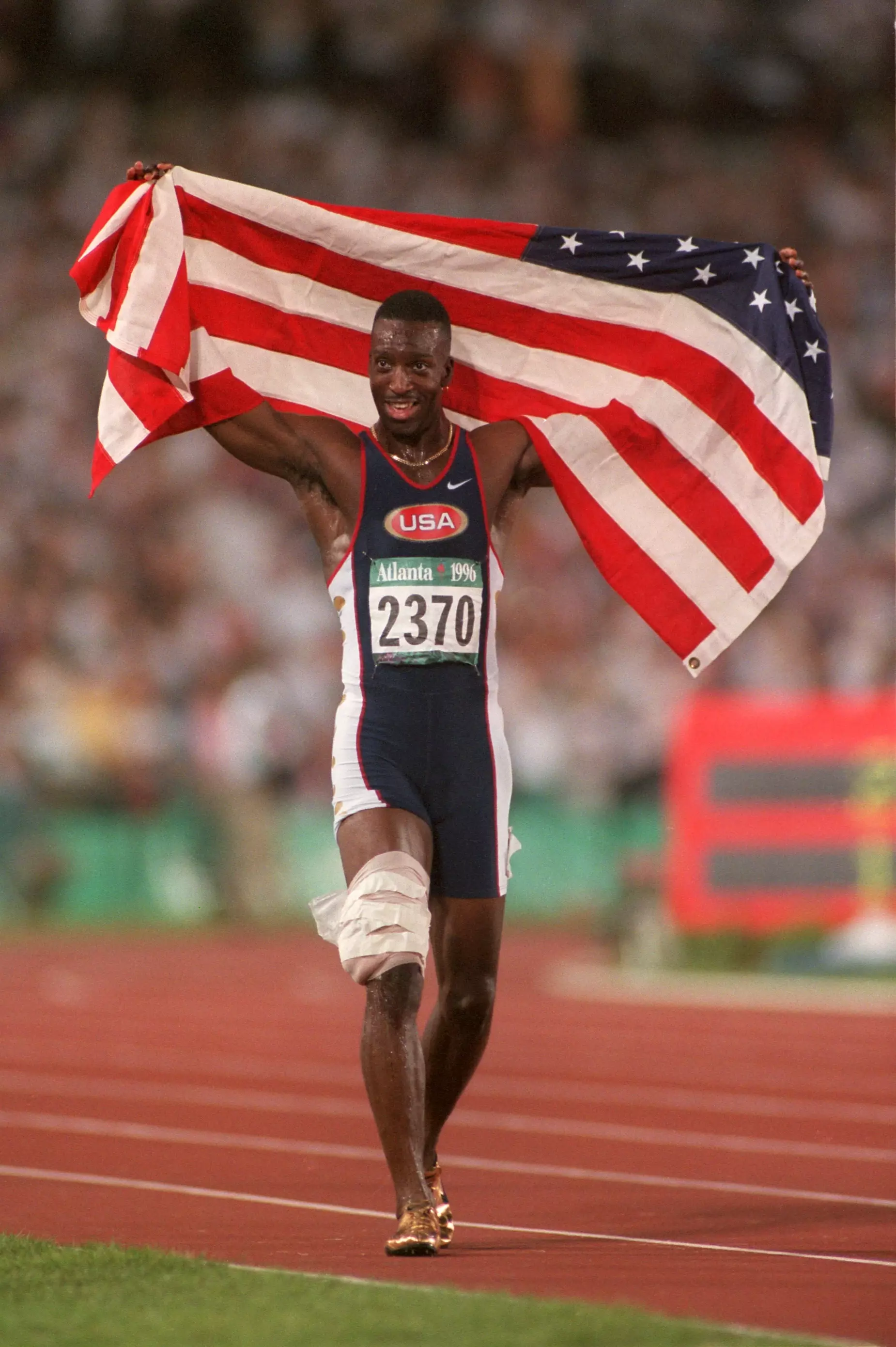 Michael Johnson celebrates after winning gold in 1996.