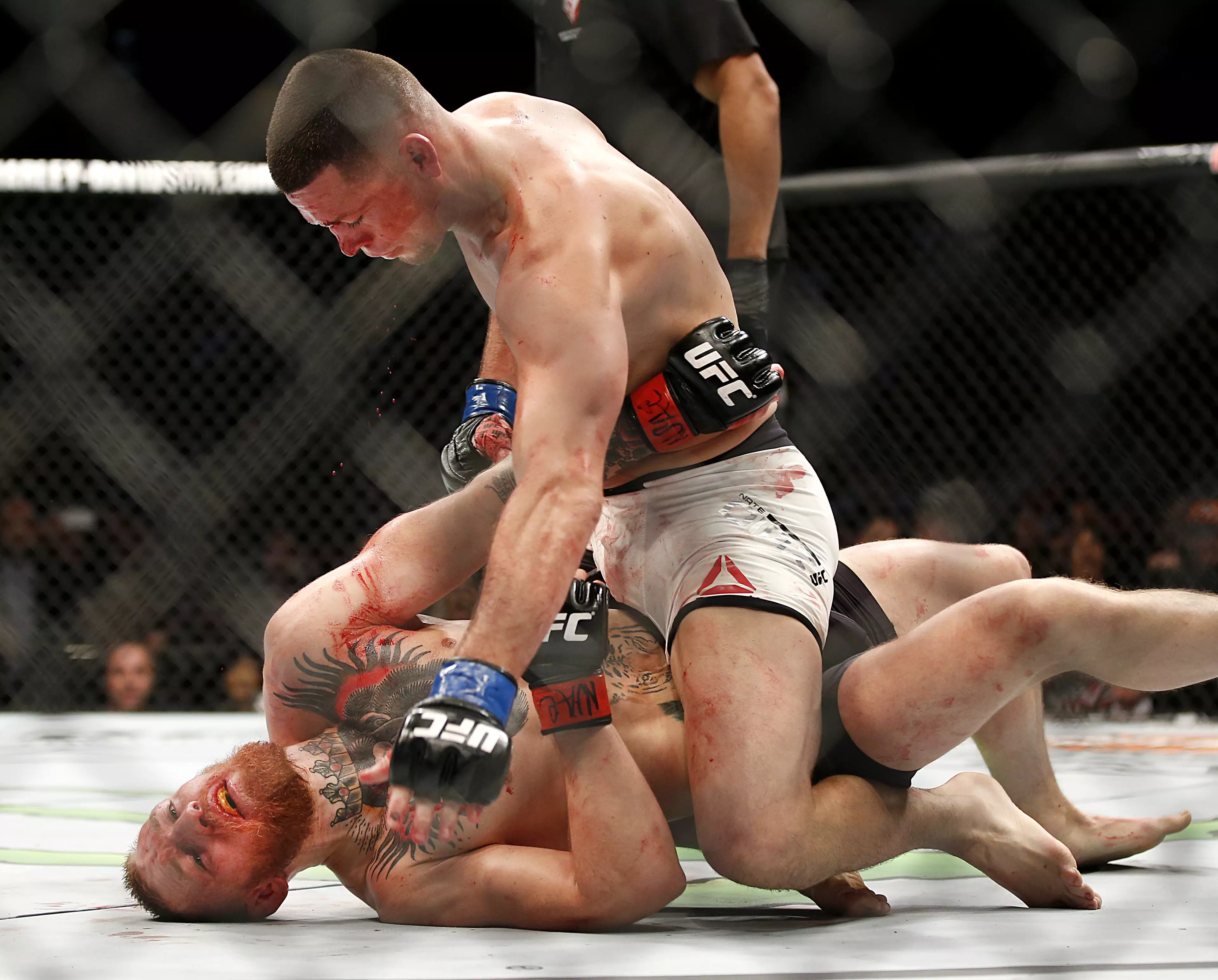 Diaz on top of McGregor in their first fight. Image: PA Images