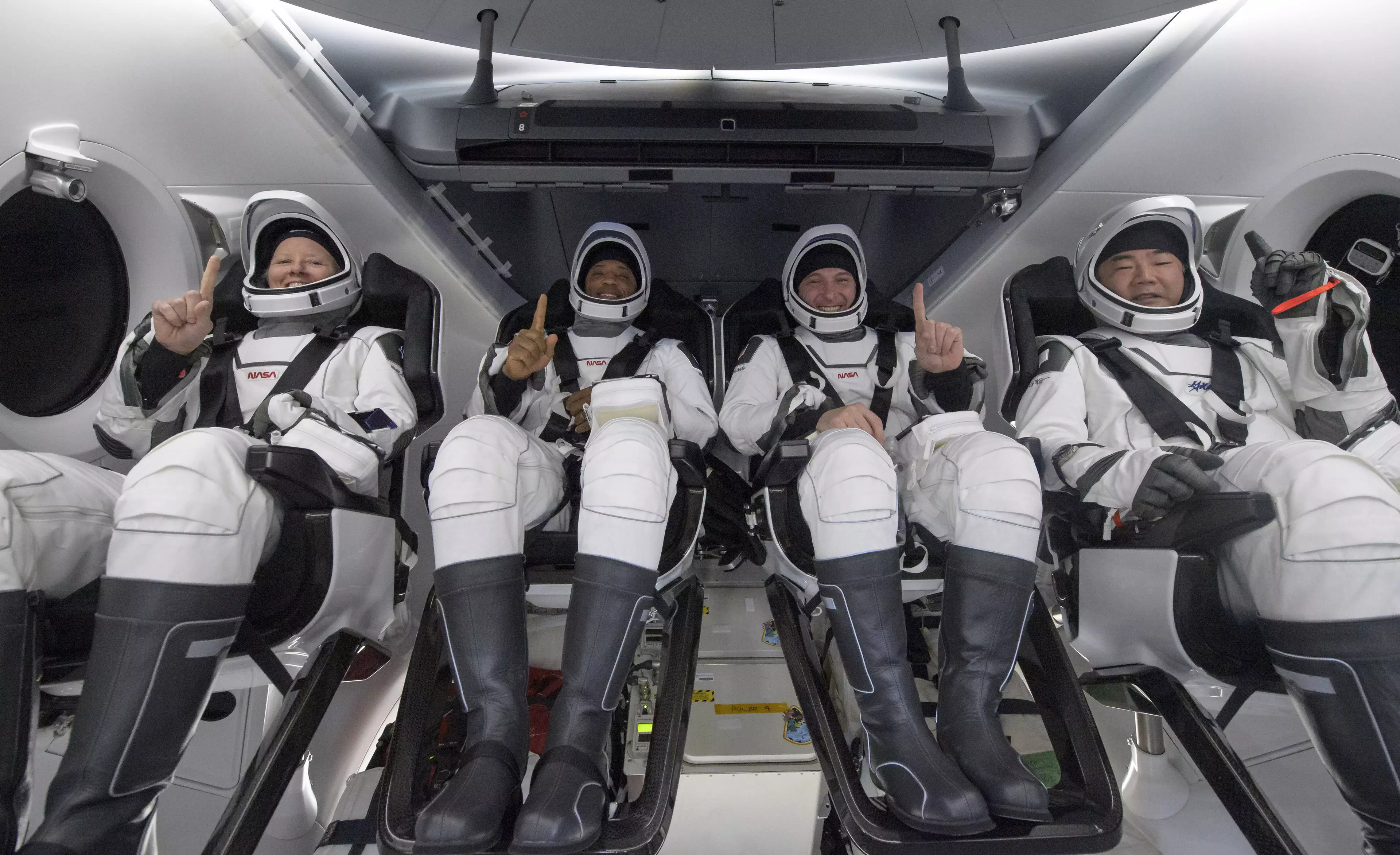 Shannon Walker, left, Victor Glover, Mike Hopkins, and Japan Aerospace Exploration Agency (JAXA) astronaut Soichi Noguchi.