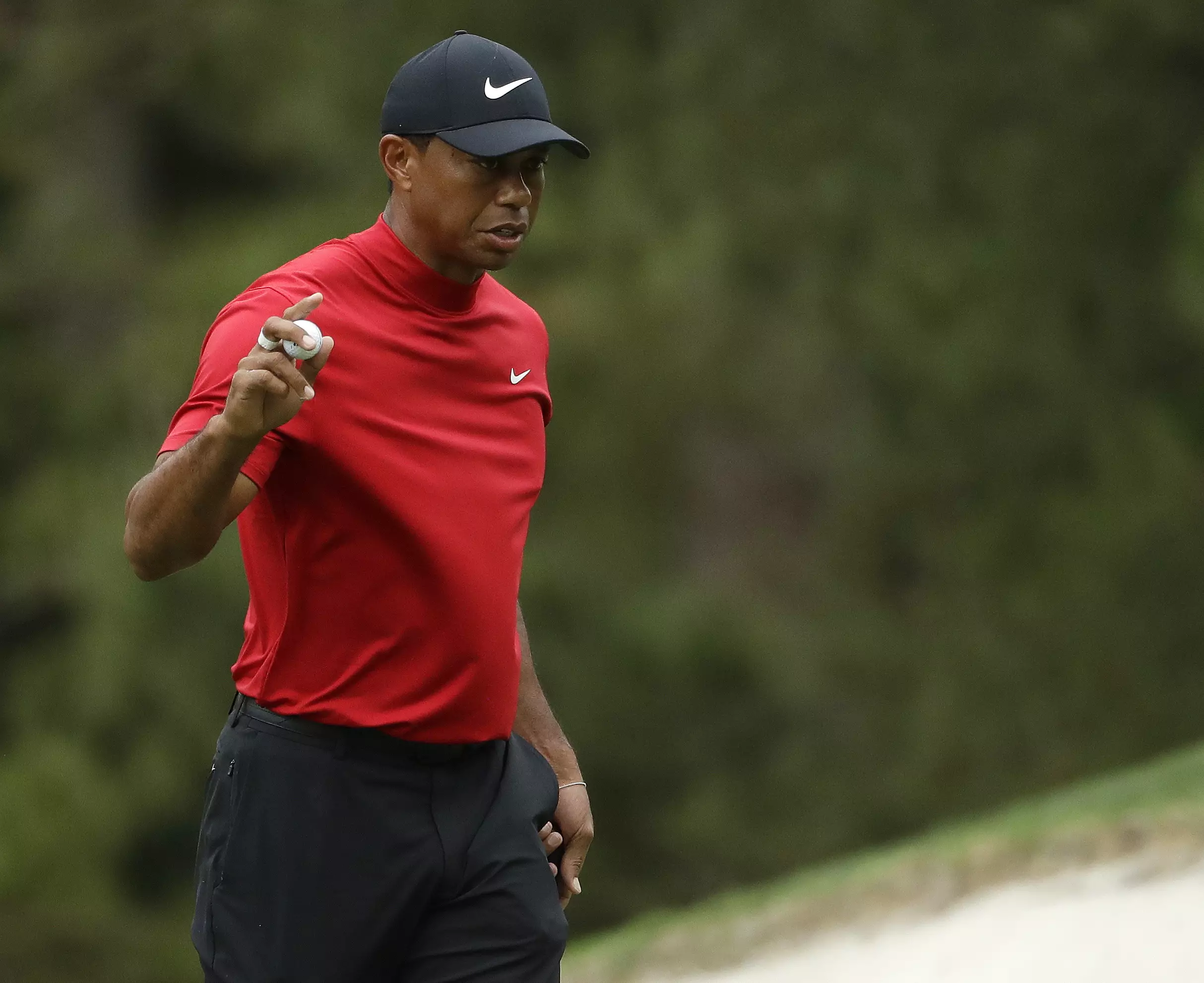 Woods was wearing his distinctive fourth round attire. Image: PA Images