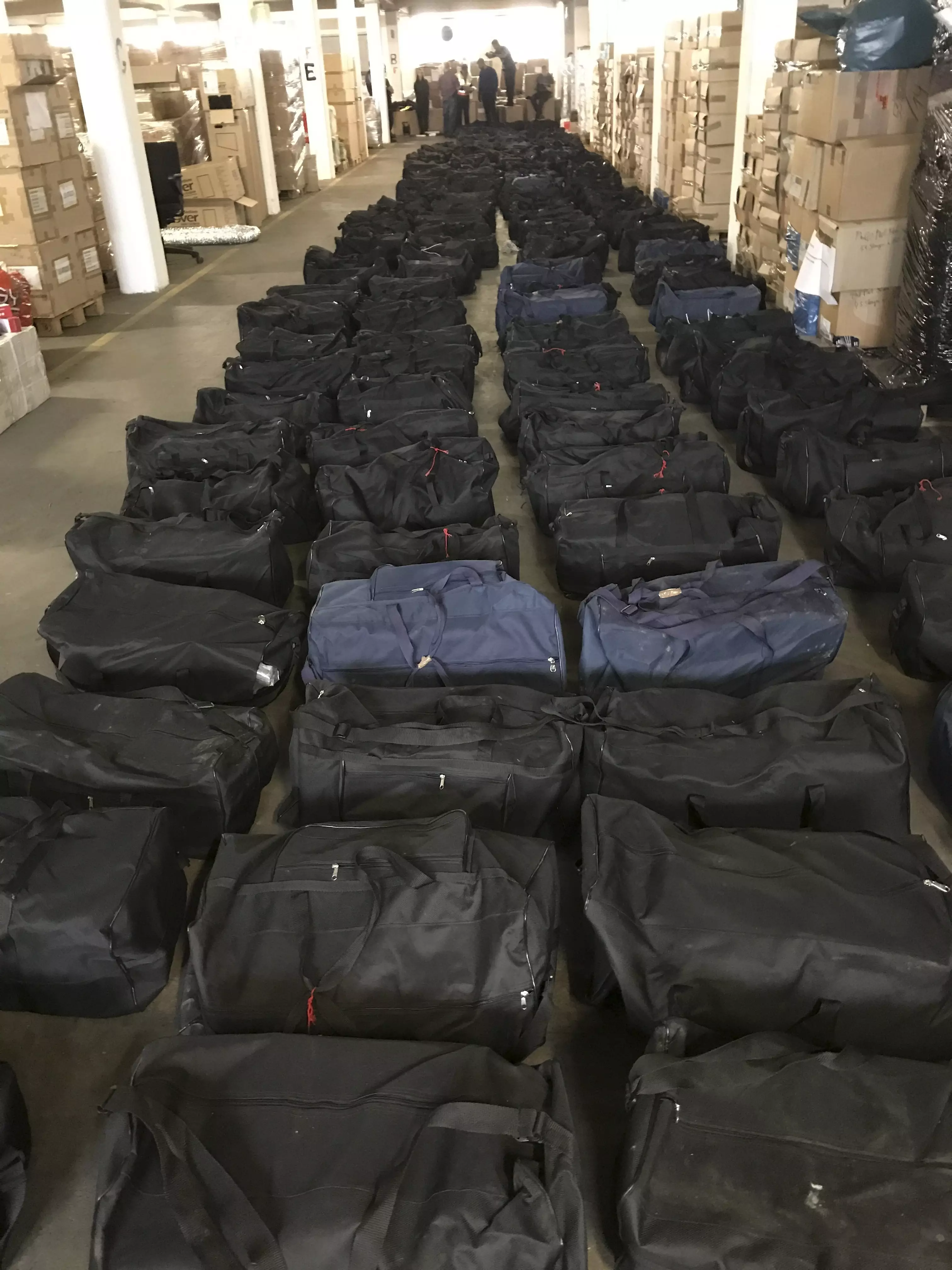 Customs officers found 211 sports bags packed with cocaine.