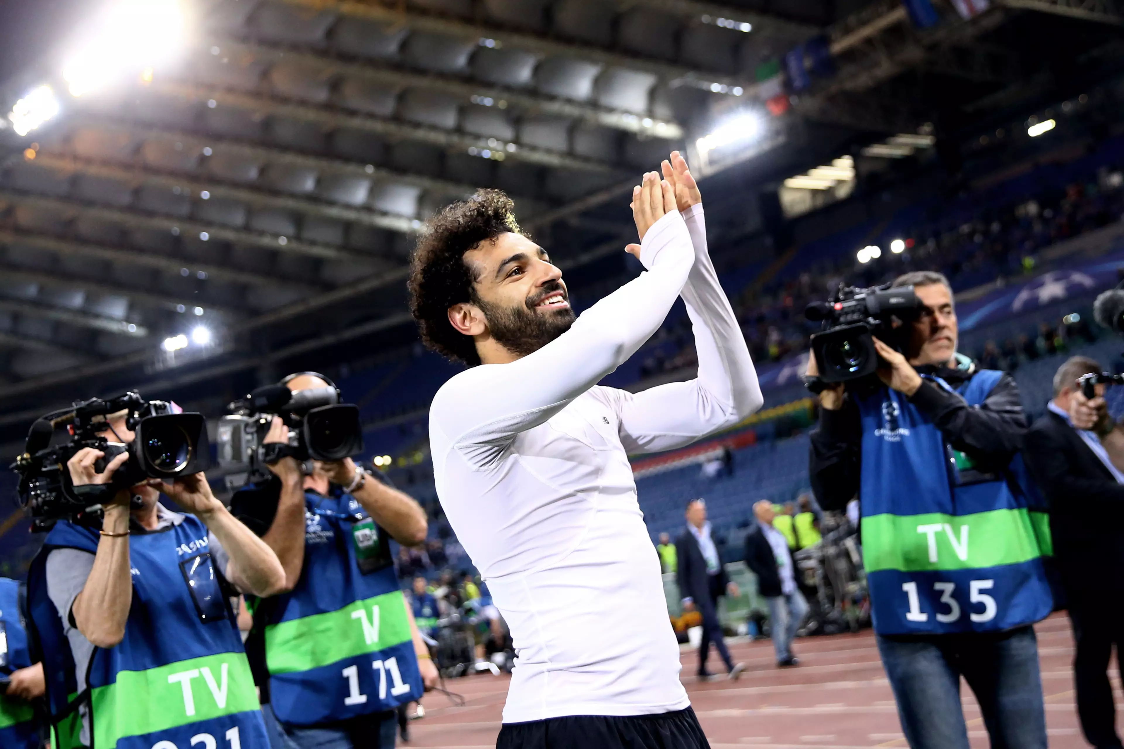 Salah applauds the traveling support in Rome. Image: PA