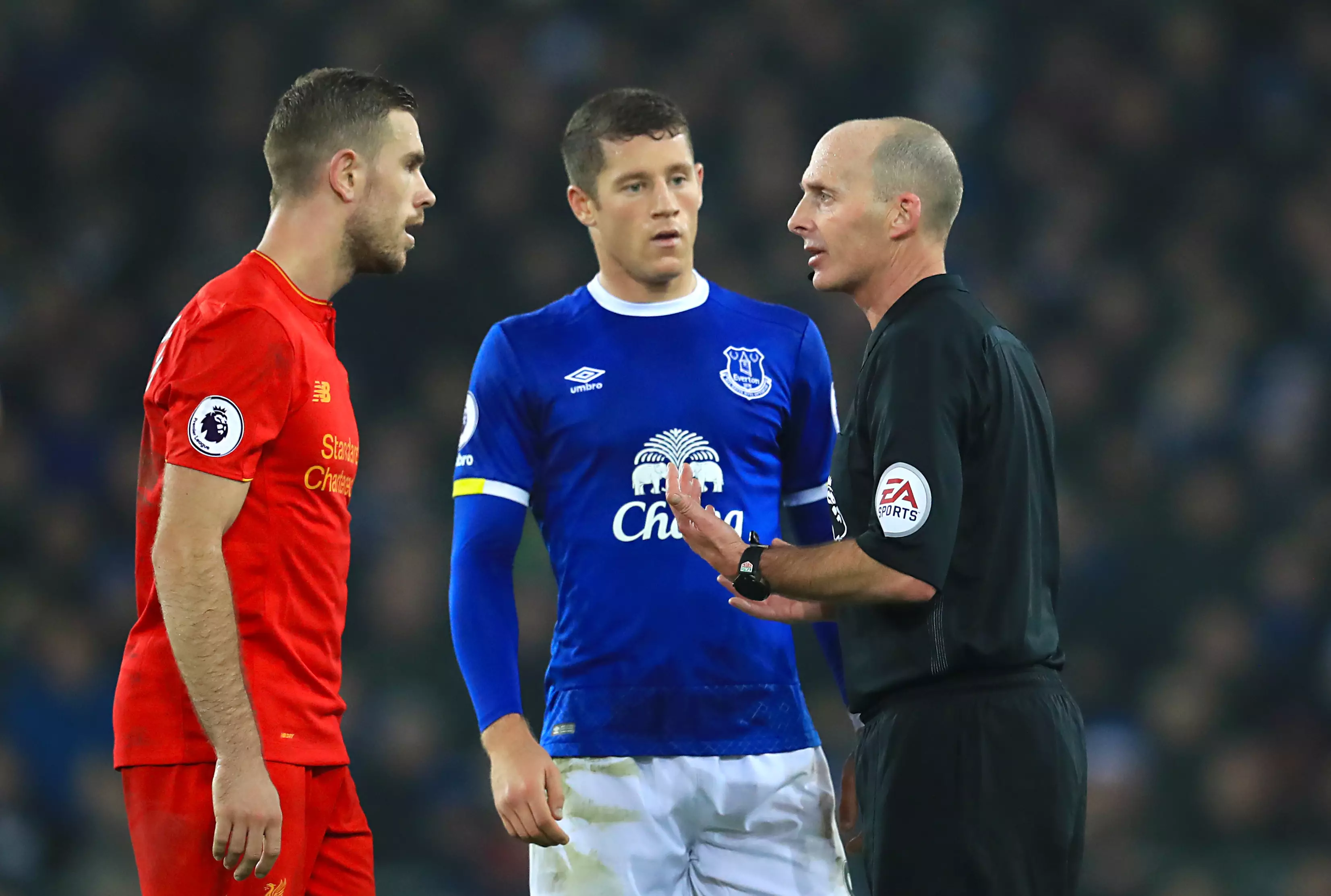 WATCH: Mike Dean's 'No Look' Yellow Card Is Truly Majestic