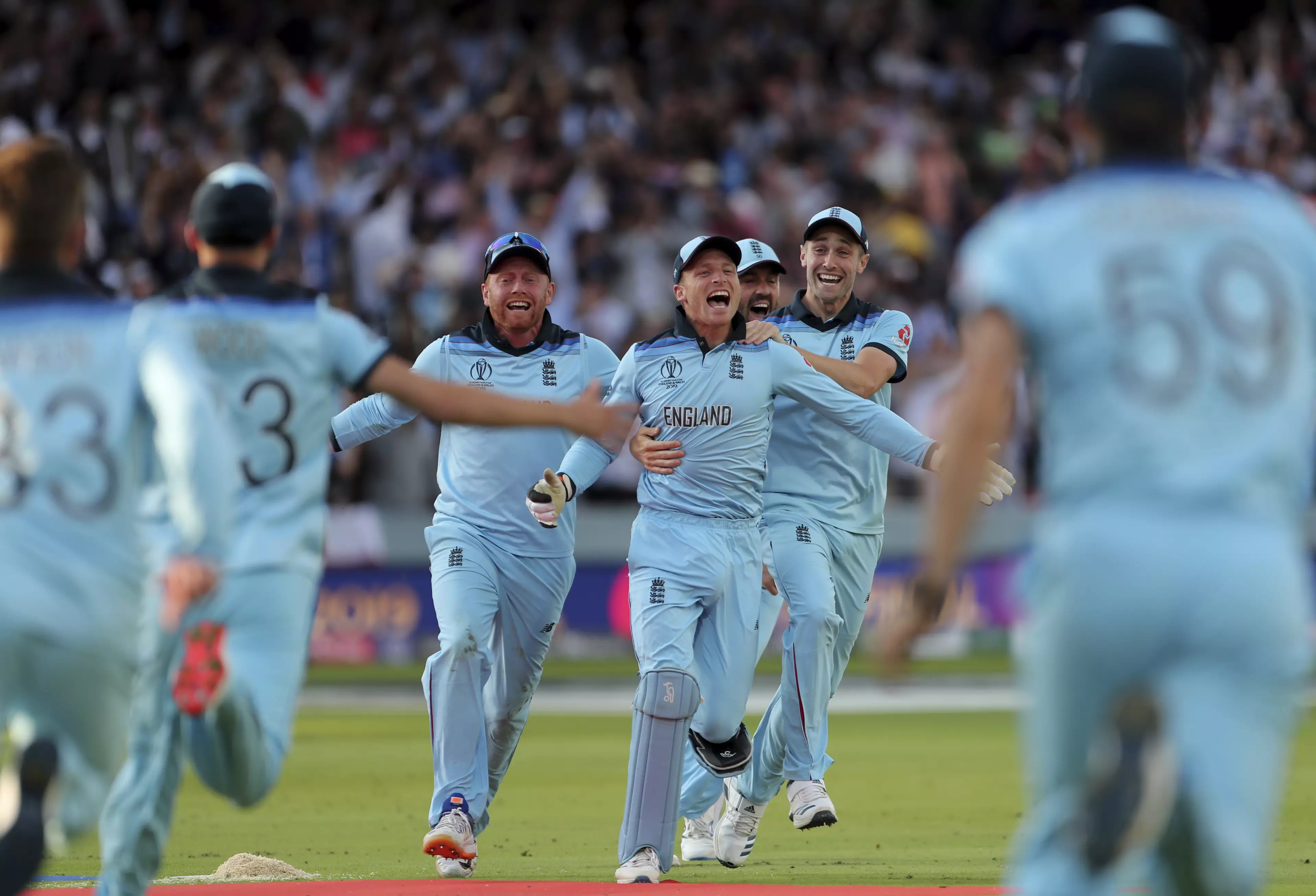 England players mob Jos Buttler after he ran out Martin Guptill. Image: PA Images