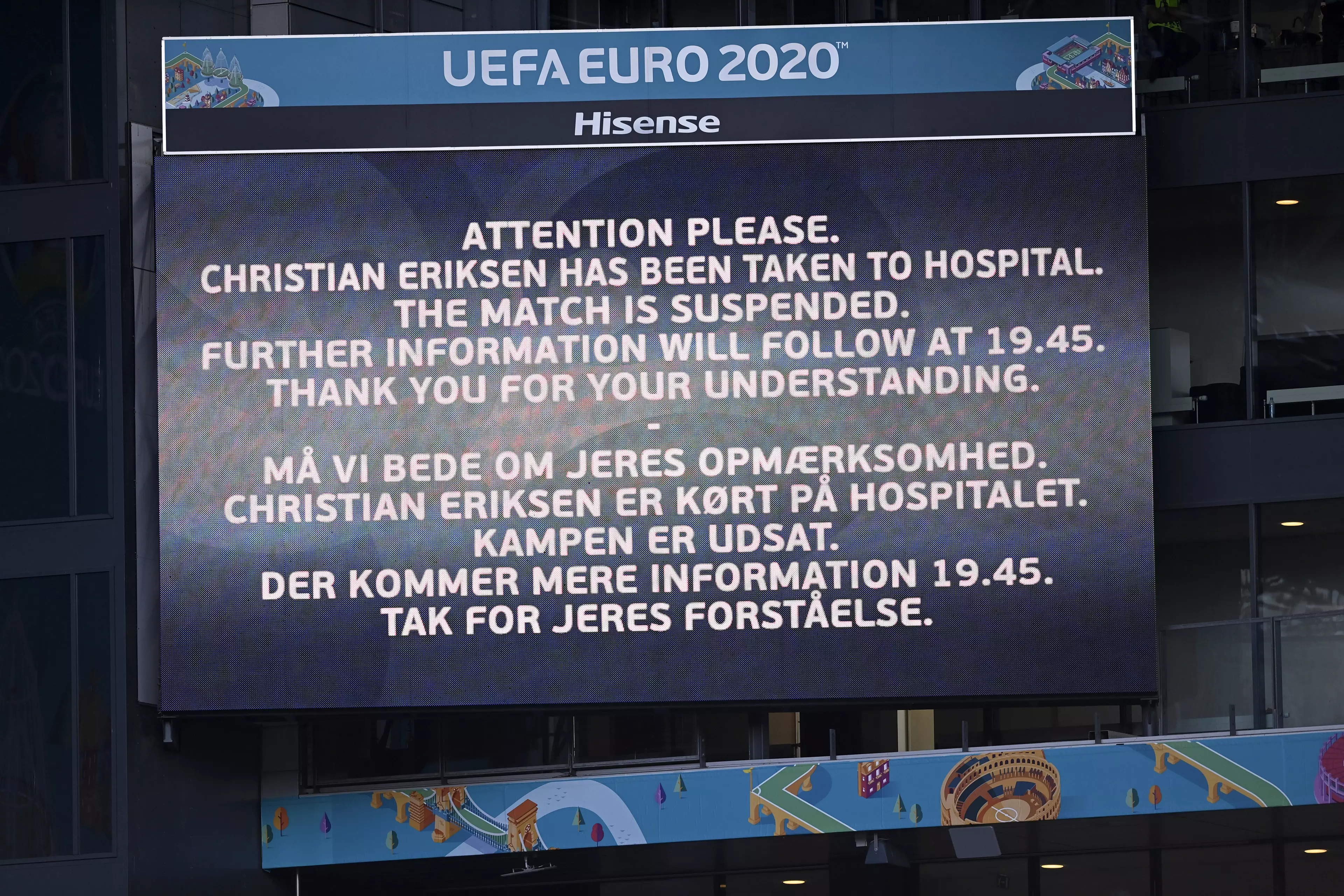 A video screen announces that Denmark's Christian Eriksen has been taken to hospital and the game is suspended.