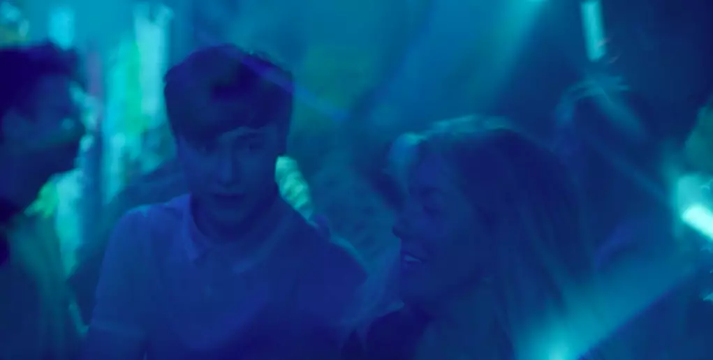 In another shot, she appears to be in a nightclub with a student (