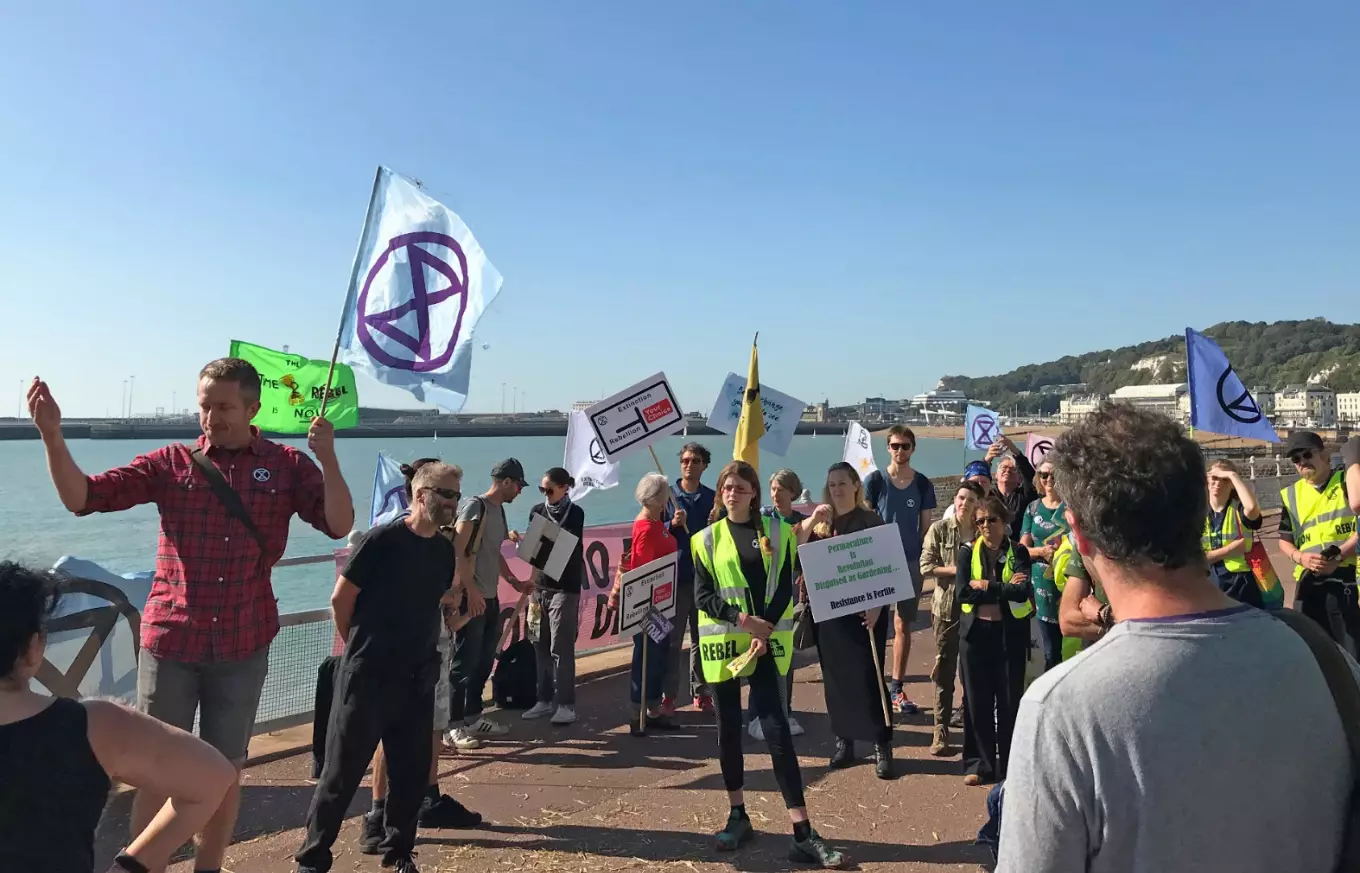 Extinction Rebellion protesters occupy one side of a dual carriageway at the Port of Dover.