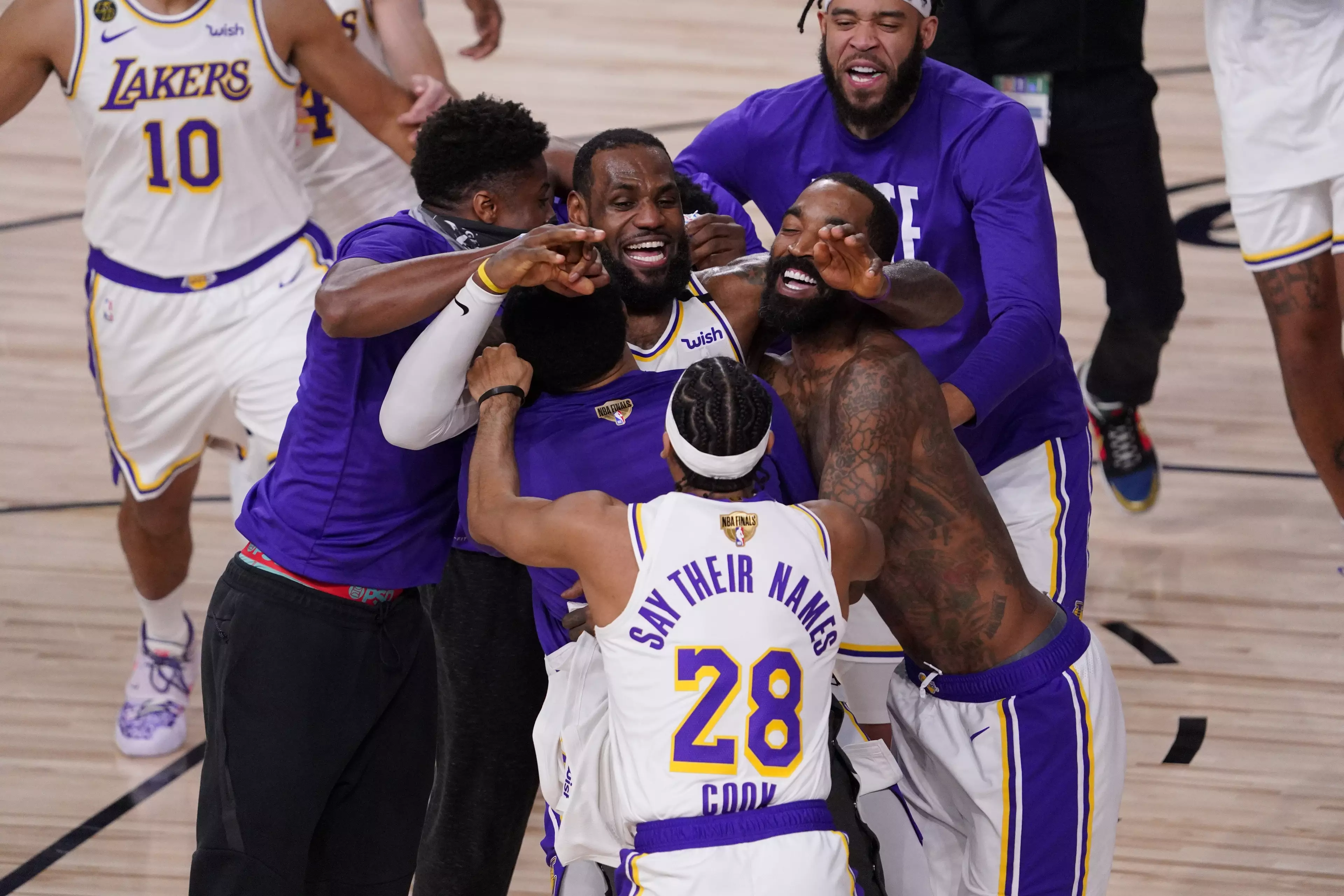 LeBron James celebrates with his Lakers teammates.
