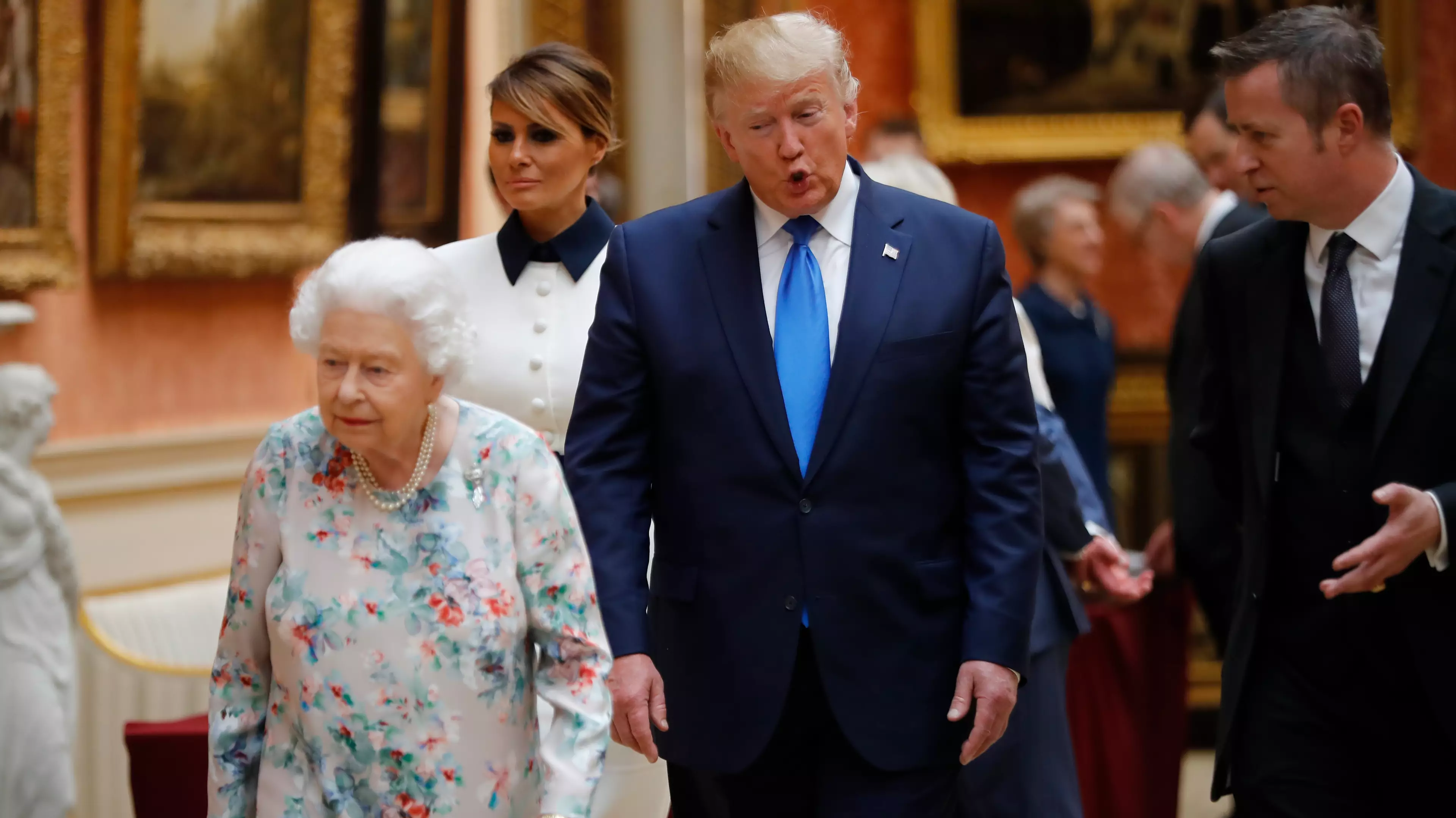 Donald Trump Appears To Break Royal Protocol And Touches The Queen