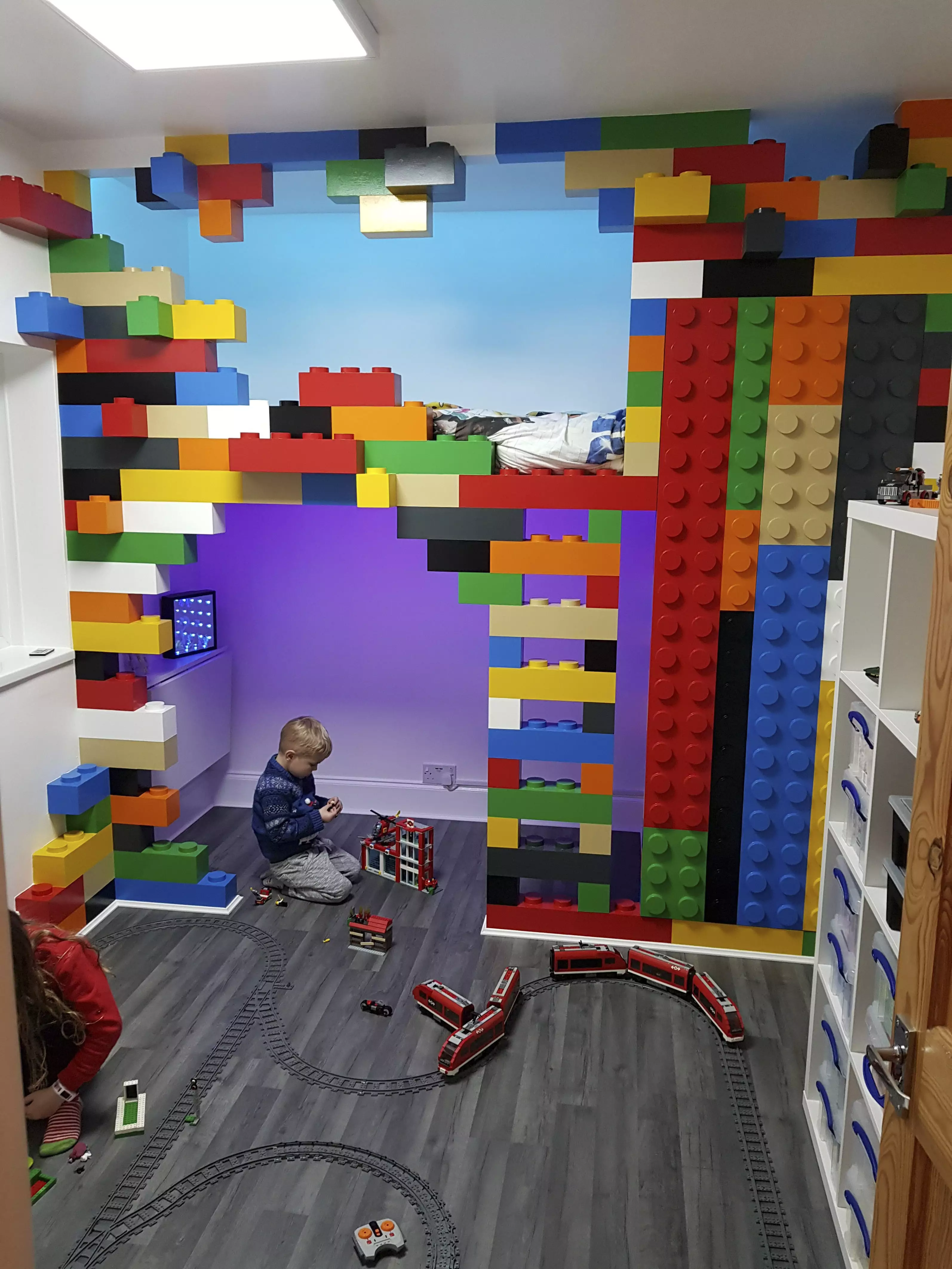 Four-year-old Michael actually seemed more taken with the expanded LEGO set his dad had collected than the bedroom design (