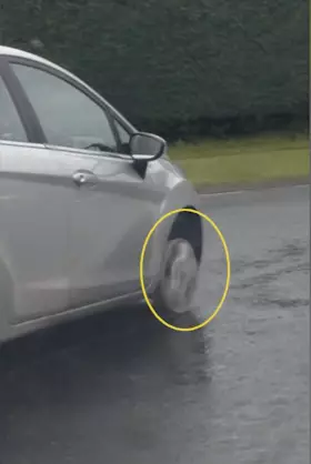 Woman drives without a tyre