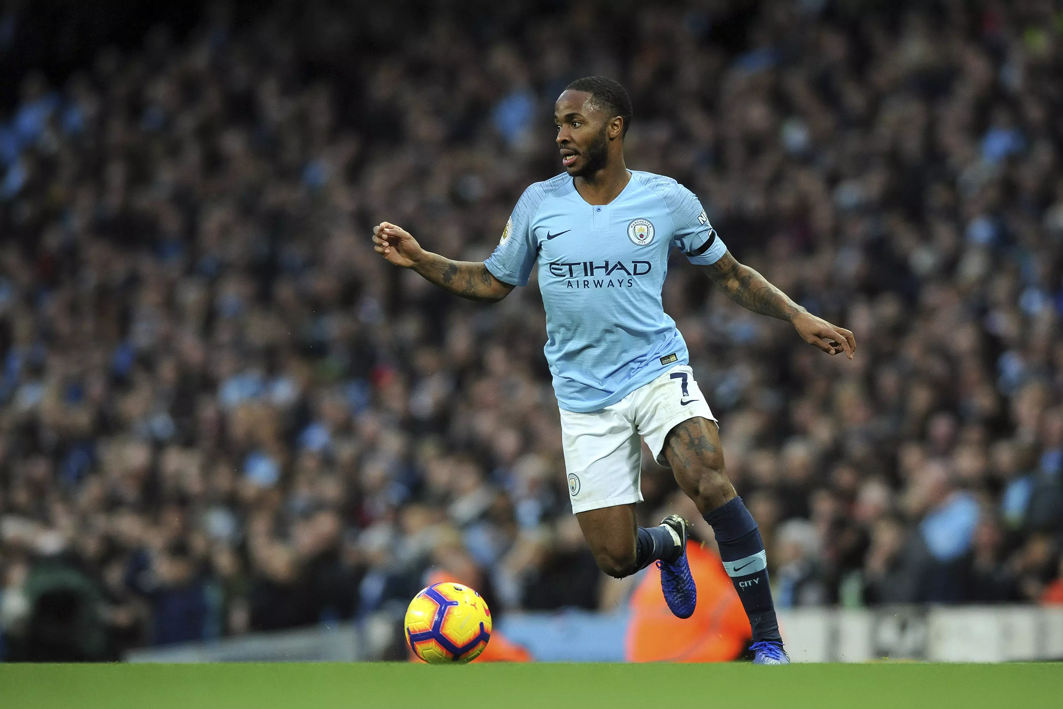 Raheem in action for Manchester City.