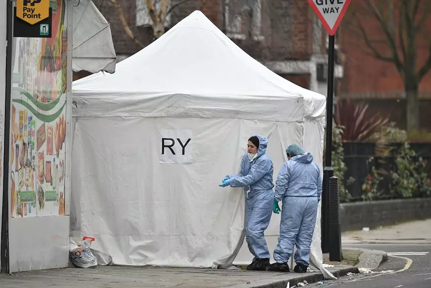 Police forensics at the scene of a stabbing in London earlier this year.