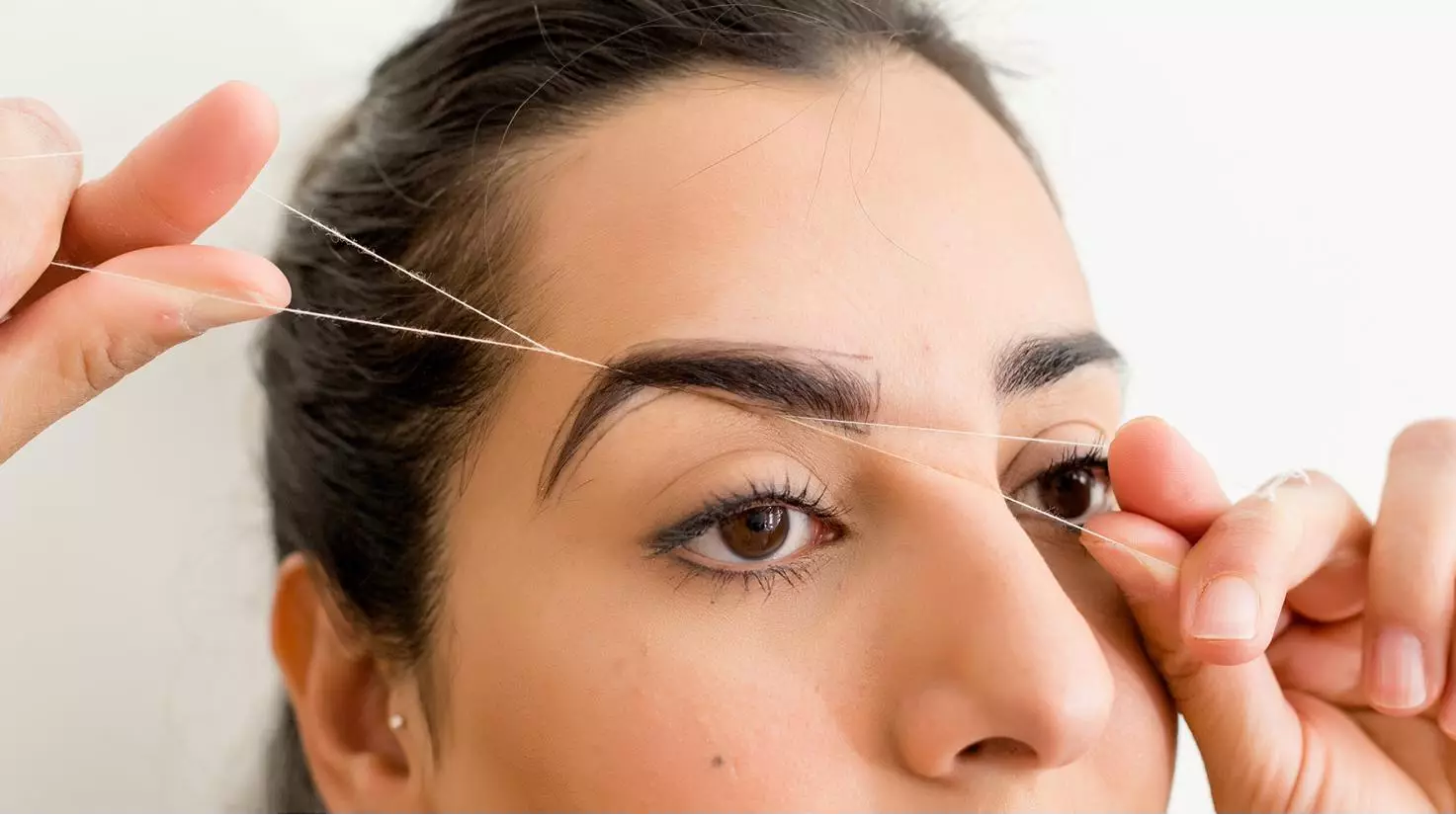 A Step-By-Step Guide To Threading Your Eyebrows At Home
