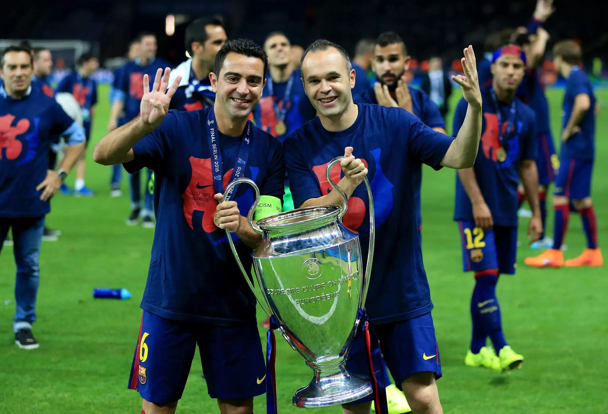 Xavi and Iniesta celebrate winning the Champions League. Image: PA