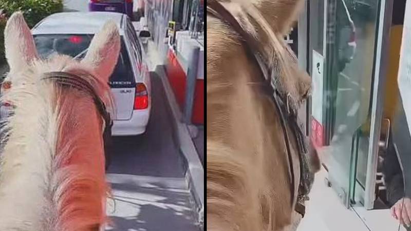当震惊的员工看着麦当劳的驾车骑行时，女人骑马穿过