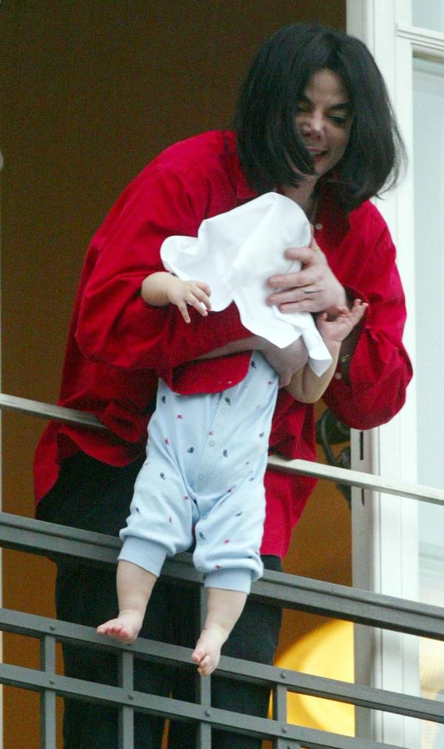 Influencer Camila Coelho Poses With Son Kai On Balcony Ledge