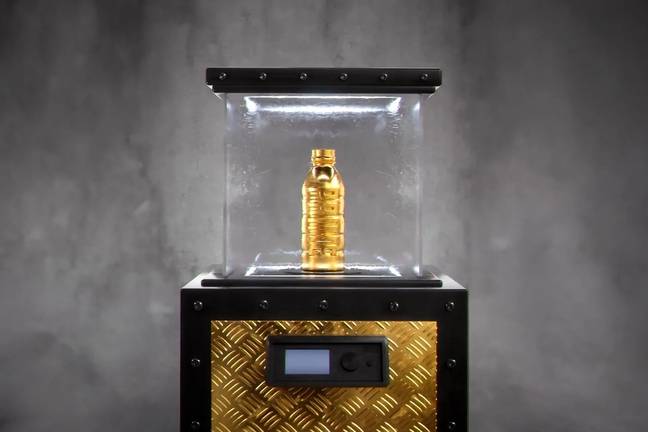 The golden PRIME bottle on display. (Image Credit: PRIME)