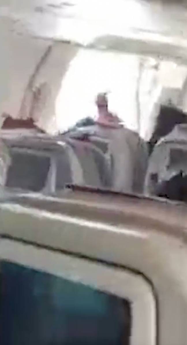 Plane passenger arrested for opening plane door in mid-air after ...
