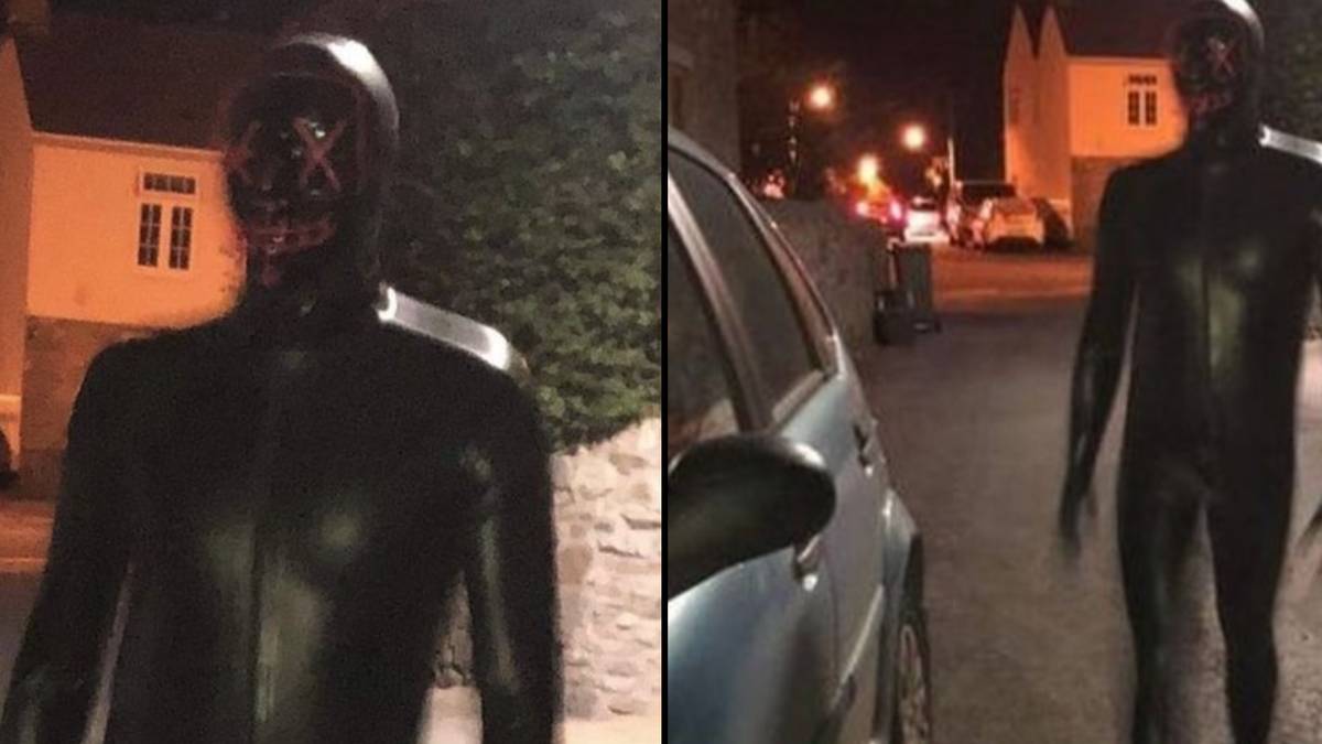 Police ride to arrest creepy masked gimp man who jumped in front of woman in car thumbnail