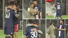 Lionel Messi mobbed by three young pitch invaders during PSG win