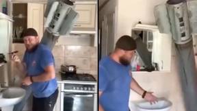 Ukrainian Man Casually Shaves While A Russian Missile Sits In His Kitchen