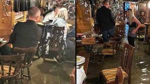 Brits Carry On Boozing And Eating As Pub Floods