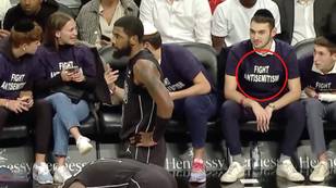 Jewish protestors wear 'fight anti-semitism' shirts while sitting courtside at Kyrie Irving game