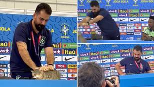 Brazil press officer's 'brutal' treatment of cat at press conference has journalists gasping in shock