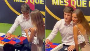 Fan appears to give Barcelona sensation Gavi her phone number during contract ceremony