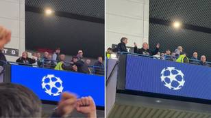 Liverpool fan celebrates on her own in Rangers end during Champions League clash