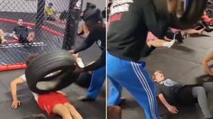 MMA coach called out for slamming students in the stomach with a huge tyre in bizarre training methods