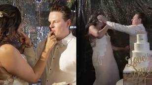 Groom pranks bride by smashing wedding cake in her face