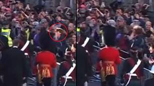 Protester yanked back after hurling abuse at Prince Andrew during Queen's coffin procession