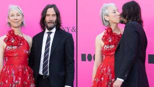Keanu Reeves and girlfriend Alexandra Grant share kiss in front of the cameras at gala event