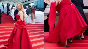 Jennifer Lawrence seen wearing comfortable flip flops underneath stunning red carpet gown