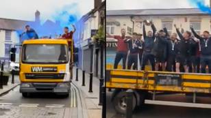 Local football club celebrate historic season with open top scaffolding lorry