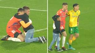 Incredible scenes as young boy runs onto the pitch to console goalkeeper after defeat